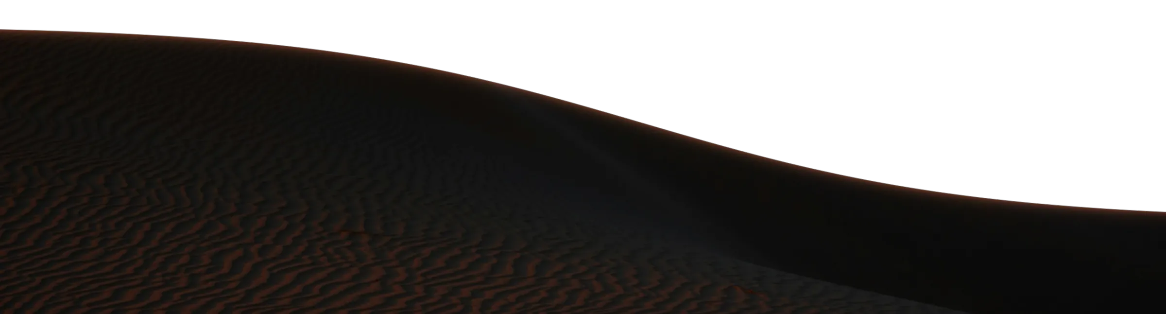 The crest of a sand dune in the foreground