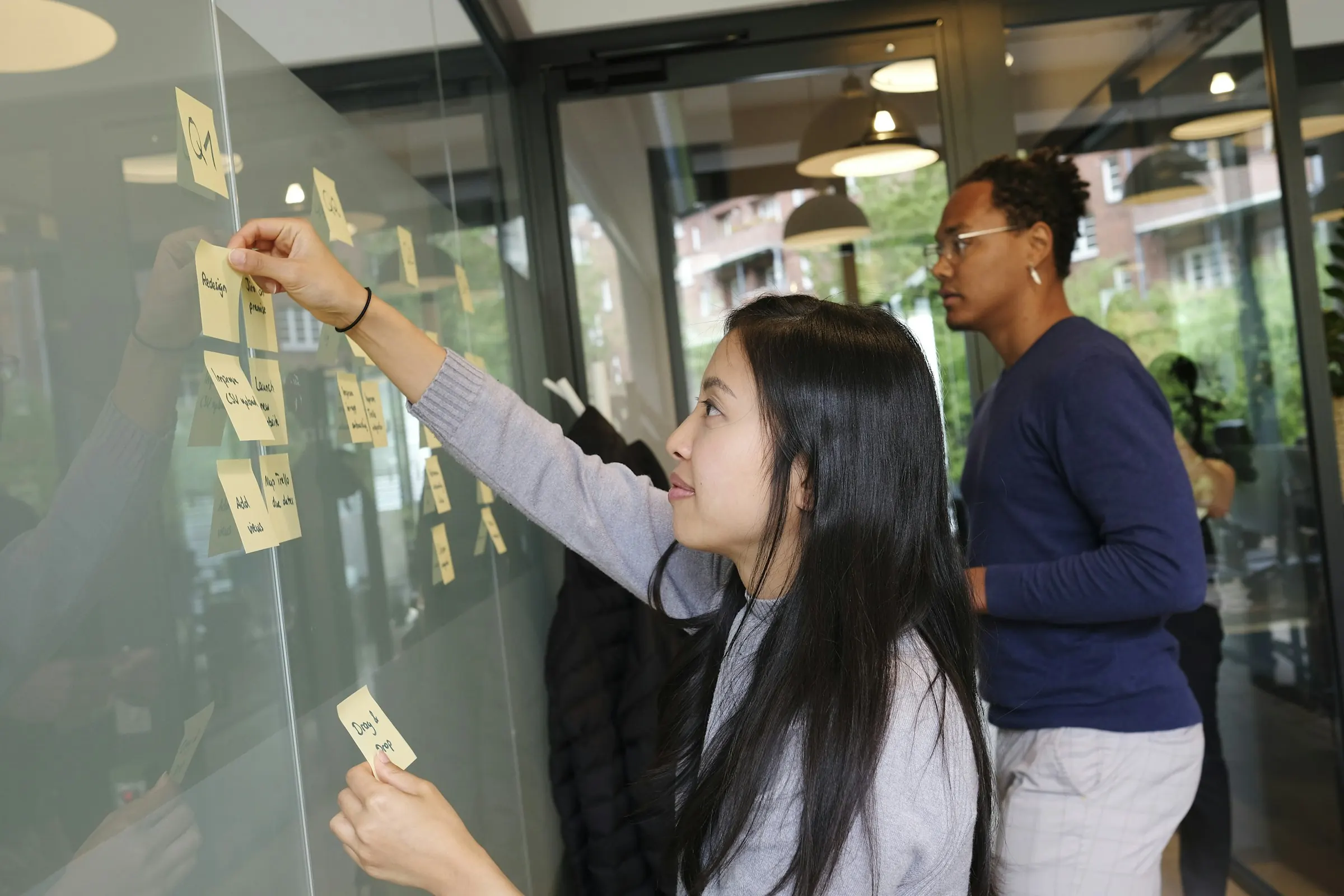 A team planning work on a Scrum board during Agile training